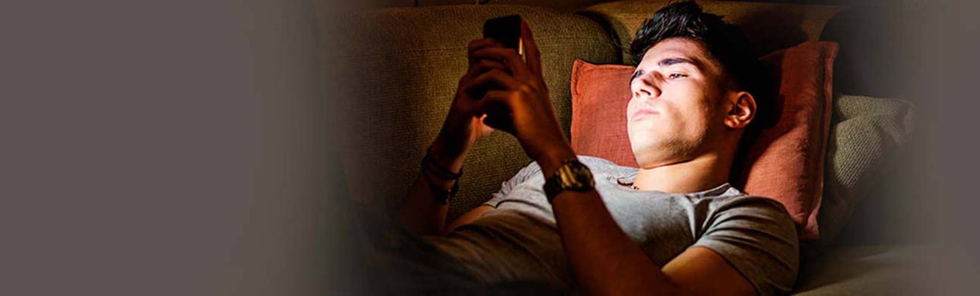 Teenager staring at phone
